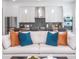 Living room with off-white sofa and view into kitchen area at 2430 Floyd St, Sarasota, FL 34239