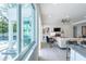 Open concept living area with pool view and kitchen island at 2430 Floyd St, Sarasota, FL 34239