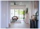 Bright living room with fireplace and sliding glass doors to backyard at 2430 Floyd St, Sarasota, FL 34239