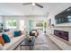 Spacious living room with fireplace, TV, and access to patio at 2430 Floyd St, Sarasota, FL 34239
