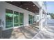 Covered patio with outdoor seating and pool access at 2430 Floyd St, Sarasota, FL 34239