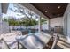 Covered patio overlooks the pool and backyard at 2430 Floyd St, Sarasota, FL 34239
