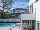 Inviting pool area with outdoor kitchen and dining space at 2430 Floyd St, Sarasota, FL 34239