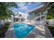 Stunning pool and patio with a modern, two-story home at 2430 Floyd St, Sarasota, FL 34239