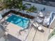 Aerial view of refreshing pool and relaxing patio furniture at 2430 Floyd St, Sarasota, FL 34239