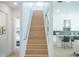 Modern light wood staircase with metal railing at 2430 Floyd St, Sarasota, FL 34239
