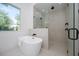 Relaxing bathroom with freestanding tub and shower at 2446 Floyd St, Sarasota, FL 34239