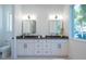 Double vanity bathroom with modern finishes at 2446 Floyd St, Sarasota, FL 34239