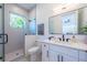 Modern bathroom with a walk-in shower and white vanity at 2446 Floyd St, Sarasota, FL 34239