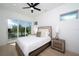 Bright bedroom with sliding door to balcony and hardwood floor at 2446 Floyd St, Sarasota, FL 34239