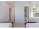Bright bedroom with two twin beds and walk-in closet at 2446 Floyd St, Sarasota, FL 34239