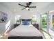 Main bedroom with sliding glass doors leading to private balcony at 2446 Floyd St, Sarasota, FL 34239