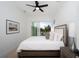 Bright bedroom with sliding door to balcony and hardwood floor at 2446 Floyd St, Sarasota, FL 34239