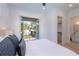 Bedroom with queen bed and access to balcony at 2446 Floyd St, Sarasota, FL 34239