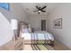 Bright bedroom with sliding door to balcony and hardwood floor at 2446 Floyd St, Sarasota, FL 34239