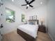 Bright bedroom with a comfortable bed, two nightstands, and artwork at 2446 Floyd St, Sarasota, FL 34239