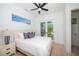 Bright bedroom with a queen bed and private balcony access at 2446 Floyd St, Sarasota, FL 34239
