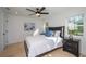 Bright bedroom with ceiling fan and light wood floors at 2446 Floyd St, Sarasota, FL 34239