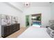 Bright bedroom with pool view and sliding glass doors at 2446 Floyd St, Sarasota, FL 34239