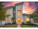 Stunning modern home with light stone and gray exterior at sunset at 2446 Floyd St, Sarasota, FL 34239
