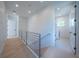 Bright hallway with light wood floors and access to laundry at 2446 Floyd St, Sarasota, FL 34239