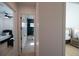 Hallway with light walls and doors to bedrooms and bathroom at 2446 Floyd St, Sarasota, FL 34239