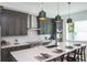 Modern kitchen with dark cabinetry, quartz countertops, and island at 2446 Floyd St, Sarasota, FL 34239