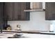 Modern kitchen with dark cabinets and quartz countertops at 2446 Floyd St, Sarasota, FL 34239