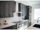 Modern kitchen with stainless steel appliances and dark cabinetry at 2446 Floyd St, Sarasota, FL 34239