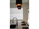 Kitchen island with seating and modern pendant lighting at 2446 Floyd St, Sarasota, FL 34239