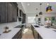 Modern kitchen with dark cabinetry, quartz countertops, and island at 2446 Floyd St, Sarasota, FL 34239