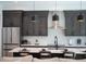 Modern kitchen with stainless steel appliances and dark cabinets at 2446 Floyd St, Sarasota, FL 34239