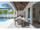 Outdoor kitchen with built-in grill and dining area at 2446 Floyd St, Sarasota, FL 34239