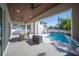 Relaxing pool area with patio furniture and grilling station at 2446 Floyd St, Sarasota, FL 34239