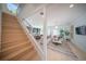 Modern staircase with metal railing overlooking the living room at 2446 Floyd St, Sarasota, FL 34239
