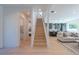 Light oak staircase offering views of living area and kitchen at 2446 Floyd St, Sarasota, FL 34239