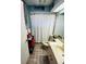 Clean bathroom with a shower/tub combo and updated vanity at 4419 Muirfield Dr, Bradenton, FL 34210