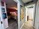 Guest bedroom with bathroom access and a red accent wall at 4419 Muirfield Dr, Bradenton, FL 34210