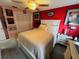 Bright bedroom with a queen-size bed and ample closet space at 4419 Muirfield Dr, Bradenton, FL 34210