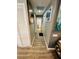 Long hallway with light wood laminate flooring at 4419 Muirfield Dr, Bradenton, FL 34210