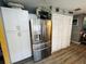 Updated kitchen, stainless steel refrigerator, white cabinets and pantry at 4419 Muirfield Dr, Bradenton, FL 34210