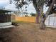 Large backyard with wooden fence and storage shed at 4709 Foy Pl, Sarasota, FL 34243