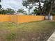 Backyard view, showing a wooden fence at 4709 Foy Pl, Sarasota, FL 34243