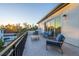 Spacious balcony boasting sunset views and patio furniture at 2420 Floyd St, Sarasota, FL 34239