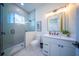 Clean bathroom with walk-in shower and modern vanity at 2420 Floyd St, Sarasota, FL 34239