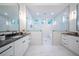 Modern bathroom with double vanity, soaking tub, and walk-in shower at 2420 Floyd St, Sarasota, FL 34239