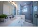 Modern bathroom with blue tile shower and white vanity at 2420 Floyd St, Sarasota, FL 34239