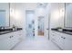 Modern bathroom with double vanity and access to hallway at 2420 Floyd St, Sarasota, FL 34239