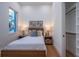Bright bedroom with wood floors, double closets, and a window at 2420 Floyd St, Sarasota, FL 34239