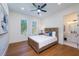 Comfortable bedroom with ceiling fan and en-suite bathroom at 2420 Floyd St, Sarasota, FL 34239